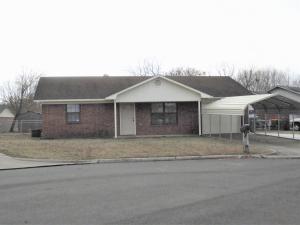 Clean brick 2 bedroom 1 bath home with single garage with opener, add'l covered parking (metal carport) and add'l uncovered concrete parking; backyard is fenced and crossfenced with chain link; ceramic tile in kitchen, down hall and in bath, carpet in bedrooms new, backyard is wide because of cul-de-sac lot