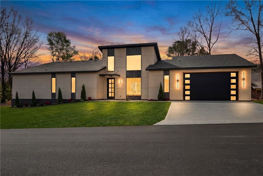 Brand-new 2026 construction offering 1,744 sq. ft. of thoughtfully designed, single-level living. This 3-bedroom, 2.5-bath home blends modern luxury with high-end upgrades rarely found in comparable new construction. Features include a custom fireplace mantle, stained concrete driveway, full stained fencing with lights, sod, and a 2-car garage with epoxy flooring. The kitchen is equipped with a waterfall island, upgraded backsplash, refrigerator, and a cup rinse. The primary suite offers a walk-in closet and spa-inspired walk-in shower, plus a sitting area. Located .5 miles from renowned biking trails, and minutes from scenic lakes and golf courses in Bella Vista. Over $42,000 in documented upgrades beyond standard builder specifications support this home’s elevated quality, design, and value.