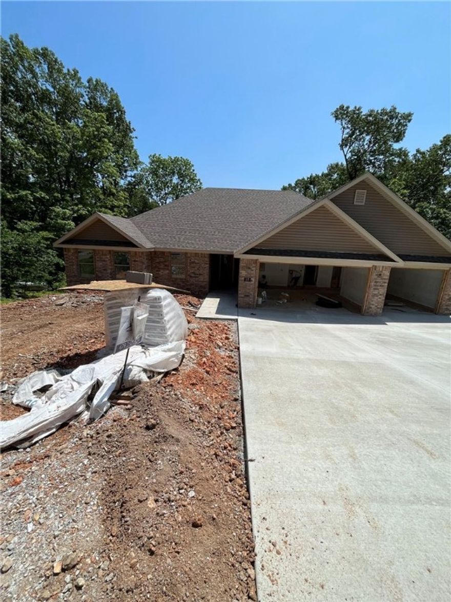 New construction 4-bedroom, 2-bath single-story home with a 3-car garage on nearly half an acre. This 2,077 sqft home features LVP flooring in the main living areas, a fireplace, and a spacious deck overlooking the large backyard. The property backs to a common area with access to Lake Avalon—perfect for outdoor enjoyment. Located just minutes from popular trails and only a few minutes off Hwy 71, this home offers both convenience and a peaceful setting.