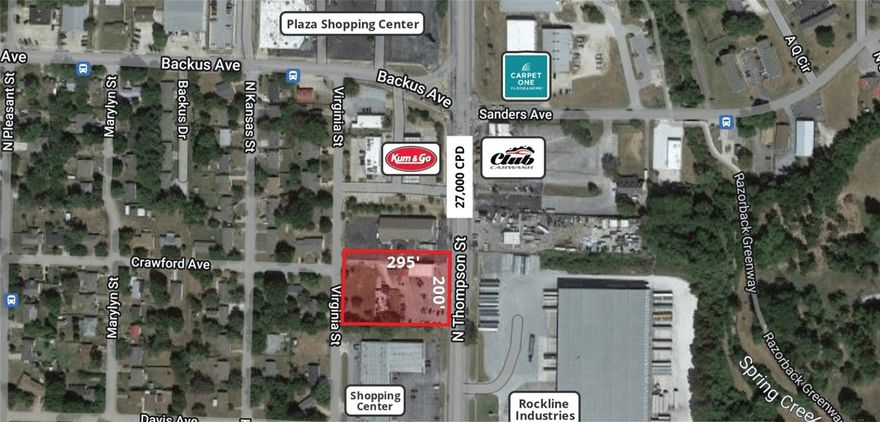 Strong development opportunity! Prime location with 200' frontage on N Thompson St & 295' of depth. Many potential uses for this lot. Close to restaurants, retail, services, and more. 10 minutes to I-49 access with a a central location to Rogers and Fayetteville via 71B.  Close to Tyson Foods and George's. Value is in the land. Open floor plan with 2 restrooms. New HVAC, paint, and repaved parking lot. Ideal for retail or showroom. Office space attached to the side of building could be a second potential income stream (no access to main space).