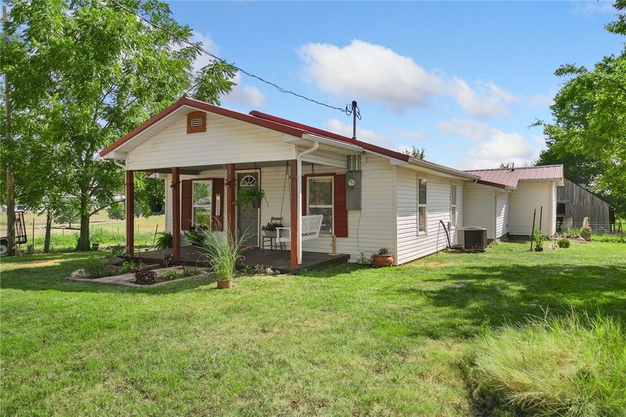 This adorable 3-bedroom, 2-bath home perfectly blends country charm with stylish updates. Inside, you’ll find a warm and inviting layout with gorgeous concrete countertops, cozy living spaces, and plenty of natural light. The kitchen is a true centerpiece—ideal for cooking, entertaining, and gathering with family and friends. Nestled in a peaceful country setting, this home offers room to breathe while still being an easy drive to town. Enjoy quiet mornings on the porch, wide-open skies, and a slower pace of life without sacrificing modern comforts. Whether you’re looking for your first home, a place to raise a family, or a weekend getaway, this one checks all the boxes.