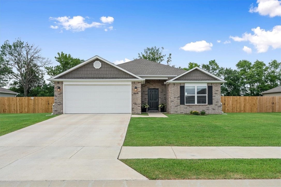 Welcome to the upgraded Raleigh Plan—an energy-efficient 4-bed, 2-bath home in Stokenbury Farms III, Elkins. Sitting on a spacious 0.33-acre lot, this home features $8K+ in blown-in insulation for low utility costs ($160–$180 electric, $80–$90 water/trash). The open layout includes a chef’s kitchen with granite countertops, stainless appliances, large pantry, and undermount sink. Enjoy a luxurious primary suite with soaker tub, double sinks, and walk-in closet. Wide hallways, brushed nickel finishes, and hard surface flooring throughout. Fully fenced backyard (est. $8–9K), gutters, and patio wired for future hot tub. 50-gal hot water tank with expansion tank. Oversized closets, attic access, and ceiling fan wiring in every bedroom. Minutes from Elkins schools and parks—this home blends modern comfort, efficiency, and style in a small-town setting!