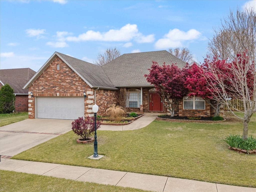Welcome to this gorgeous 4bed/2bath home with bonus flex room in the elegant Stonewood neighborhood. From here, you can WALK to the Razorback Greenway, Lake Fayetteville, & Botanical Garden of the Ozarks! Lush, professional landscaping (with irrigation system!) welcomes guests to the covered front porch. Enter & admire the glistening wood floors, stately fireplace and the tray ceilings of the living room, then turn your gaze to the functionally-designed kitchen (fridge included!) with abundant storage and bonus peninsula countertop. Expansive primary suite features tray ceilings, wrap-around, walk-in closet (it's a must-see!) & spa-like primary bathroom. The 3 additional bedrooms all have ample space & storage for any needs you may have. Front exterior features beautiful uplights to accent the home once the sun goes down and fully-fenced backyard features covered patio & additional landscaping. Minutes away from NWA Mall, Springdale and Paradise Valley Athletic & Golf Clubs, shops, businesses, & restaurants galore!