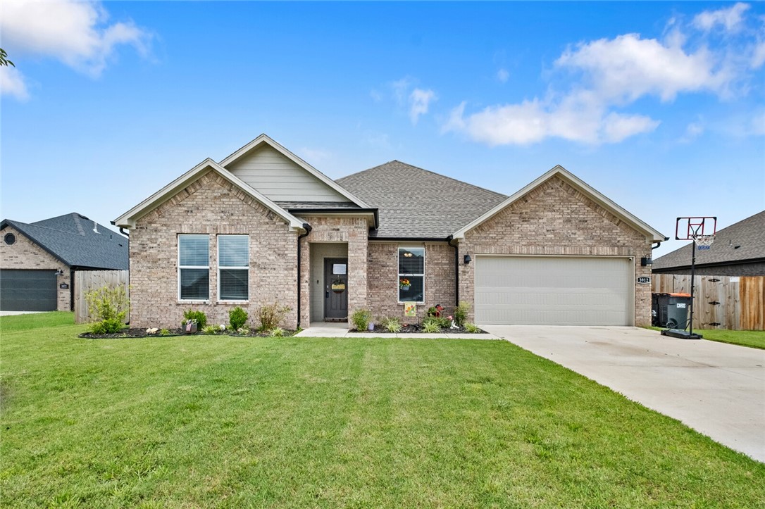 Almost-new home located near C.L. "Charlie" and Willie George Park!
This 4-bedroom, 2-bath home offers the perfect blend of comfort, style, and convenience—especially if you’re looking to be close to Fayetteville without paying Fayetteville prices.
Step into an inviting open floor plan with a spacious kitchen, dining, and living area ideal for modern living. The kitchen features a large quartz island with a sink overlooking the living room, stainless steel appliances, a walk-in corner pantry, and plenty of workspace. The cozy living room includes an electric fireplace—perfect for entertaining or relaxing evenings. The private primary suite is tucked away at the back of the home and includes a double quartz vanity, walk-in shower, and generous walk-in closets, durable luxury vinyl plank flooring throughout, ceiling fans in every bedroom and the living area, and a smart layout that maximizes flow. The all-brick exterior, covered patio, and professional landscaping complete the package with standout curb appeal.