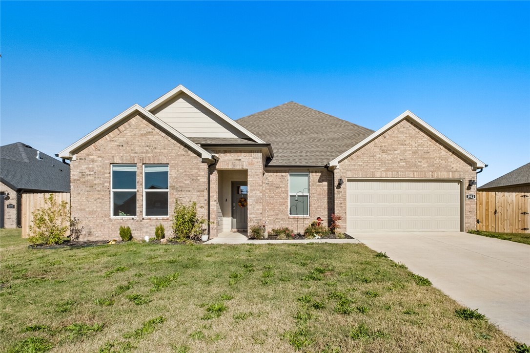 Almost-new home located near C.L. "Charlie" and Willie George Park!
This 4-bedroom, 2-bath home offers the perfect blend of comfort, style, and convenience—especially if you’re looking to be close to Fayetteville without paying Fayetteville prices.
Step into an inviting open floor plan with a spacious kitchen, dining, and living area ideal for modern living. The kitchen features a large quartz island with a sink overlooking the living room, stainless steel appliances, a walk-in corner pantry, and plenty of workspace. The cozy living room includes an electric fireplace—perfect for entertaining or relaxing evenings. The private primary suite is tucked away at the back of the home and includes a double quartz vanity, walk-in shower, and generous walk-in closets, durable luxury vinyl plank flooring throughout, ceiling fans in every bedroom and the living area, and a smart layout that maximizes flow. The all-brick exterior, covered patio, and professional landscaping complete the package with standout curb appeal.