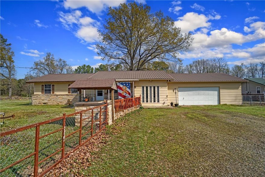 Enjoy the best of both worlds with this cozy 2-bedroom, 1.5-bath home nestled on 1.5 acres of fully fenced land. Offering peaceful country living while still being conveniently close to town, this property is ideal for those looking for privacy, space, and functionality.The home features a large master bedroom, a full bathroom, and a half bath, providing comfort and convenience. The open layout offers a warm and inviting atmosphere, perfect for relaxing or entertaining.For those needing extra storage or workspace, this property has it all! A spacious 2-car garage, a massive 40x40 shop, and additional carports and storage buildings with power provide endless possibilities--whether for hobbies, business, or storing equipment.With plenty of room to roam, breathtaking country vi