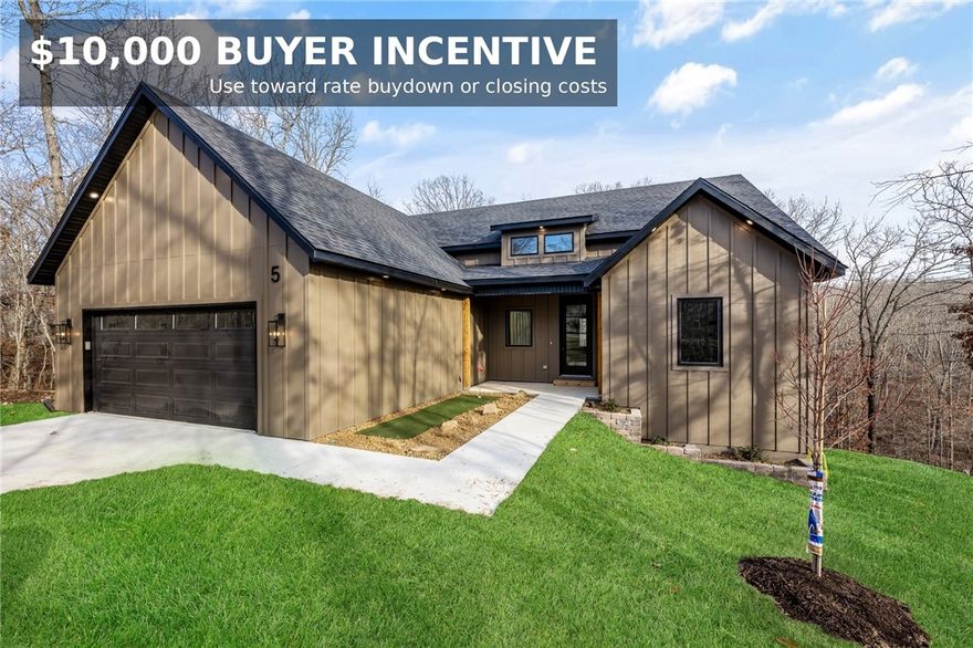 This home is truly a hole-in-one for those seeking a well-designed retreat in the Bentonville School District. Located on a quiet cul-de-sac and ideally positioned between Highlands Golf Course and Scotsdale Golf Course—with close proximity to the Bella Vista Country Club—this property offers an unbeatable Bella Vista location.

The home features abundant natural light, a split 3-bedroom, 2-bath floor plan, and a spacious primary suite with a large soaking tub. Additional highlights include a walk-in laundry room with butler’s pantry, propane cooktop, a pocket office, and the home is prewired for sound and security. Enjoy outdoor living on the large covered deck, along with the unique bonus of a front-yard putting green. Seller is offering up to $10,000 in buyer concessions—use toward closing costs or a rate buy down.  1 year builder's warranty included for added peace of mind.