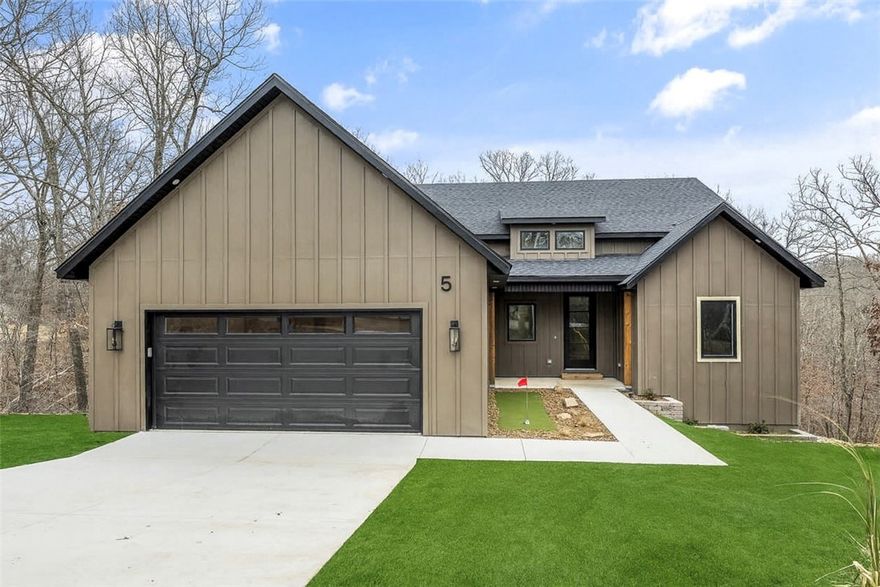 This home is truly a hole-in-one for those seeking a well-designed retreat in the Bentonville School District. Located on a quiet cul-de-sac and situated between Highlands Golf Course and Scotsdale Golf Course, with close proximity to the Bella Vista Country Club, this property offers an unbeatable Bella Vista location. The home features abundant natural light, a split 3-bedroom, 2-bath floor plan, and a spacious primary suite with a large soaking tub. Additional highlights include a walk-in laundry room with butler’s pantry, propane cooktop, a pocket office, and the home is prewired for sound and security. Enjoy outdoor living on the large covered deck, plus a unique bonus of a front-yard putting green.