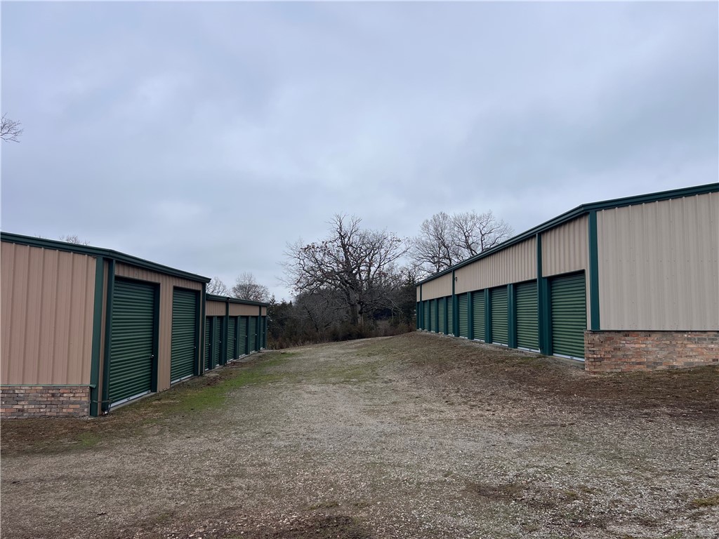 Excellent business opportunity with 33 storage units currently and more space to grow if you wanted to or fence off and have exterior area for storage on the property. There is 26 units are 10X15, 2 Units are 14X30, 4 units are 6X15, and 1 unit that is 10X30 Drive Through. The lot next door can also be purchased with this property.