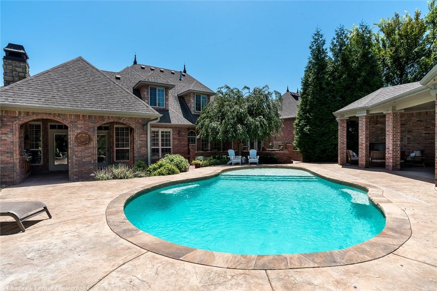 Your backyard oasis awaits at 45 Buckingham DR inside the Pinnacle Country Club. Your resort style backyard with pool has an open air pool house featuring a bar area, fireplace, dining area and more. It's set up for TV & outdoor speaker. There is even an outdoor shower and 1/2 bath. Inside you will be amazed by the quality and detail trim work everywhere. The home is a great balance between formal & casual space. 2 of the 4 large BRs are on the main level, 3 living areas + office and a great kitchen.