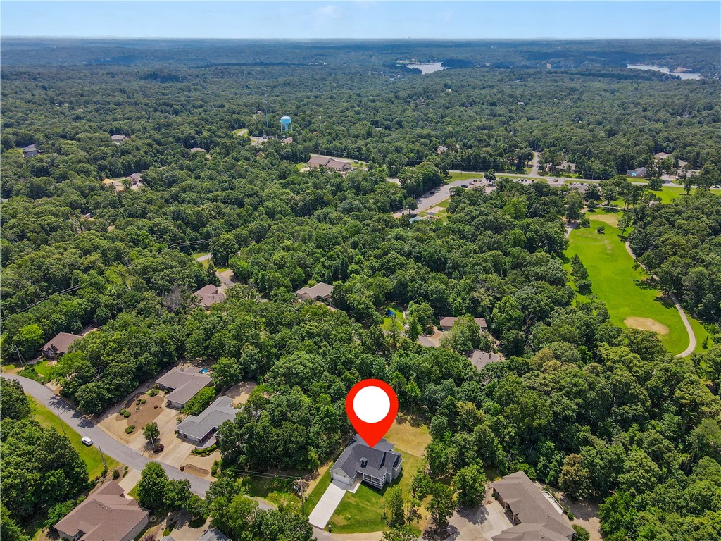 Elegant Bella Vista Home – Prime Location! Welcome to 11 Romine Lane, Bella Vista, AR, where modern comfort meets timeless charm. The 8-foot mahogany door with beveled glass opens to a bright, inviting space with recessed lighting throughout. Each room is equipped with ceiling fans, ensuring year-round comfort. The spacious living area flows to the covered back porch through 8-foot double full-glass French doors, perfect for relaxing. The master suite offers a tiled walk-in shower and Jacuzzi soaking tub, creating a spa-like retreat. This full-electric home features an oversized insulated garage and is just half a mile from Branchwood Recreation Center. Highlands Golf Course is 2 miles away, and shopping is within 15 miles. Experience modern luxury in a perfect location—schedule a tour today!