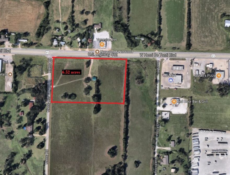 Great open & level tract of land with commercial opportunity. Located on Hwy 412 with 690' of frontage with 12,000 VPD. Great visibility, corner lot, easy access, and up to an additional 30 acres available!