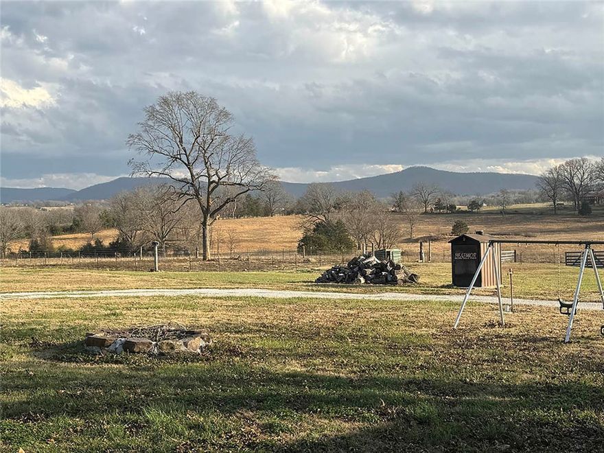 This 3-bedroom, 2-bath home sits on approximately 3 acres just minutes from Harrison, offering a comfortable country setting with the convenience of town nearby. The property features a spacious yard with fencing, making it ideal for pets, gardening, or simply enjoying the outdoors.

The home is equipped with both a wood-burning furnace and central HVAC, providing efficient heating options throughout the year. A durable metal roof adds long-term reliability and low maintenance.

Outside, the property includes a large barn and a separate workshop, offering plenty of space for equipment storage, hobbies, or small-scale projects. With open space, useful outbuildings, and easy access to town, this property offers a practical setup for those looking for a little extra room without being far from amenities.