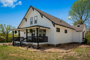 A treasured Farmhouse with historical architecture and all the amenities of a brand new construction home. East facing home with covered front porch to enjoy the sunrises and a covered back porch to enjoy the sunsets over Gaither Mountain. Almost 10 acres with two ponds and a seasonal stream. Envision two additional building sites on the property. The open floor plan provides entertaining and family gatherings with new kitchen appliances, beautiful granite counters, tiled backsplash, and pantry. The main level master suite includes a gorgeous walk-in shower, claw foot bathtub, double vanity, and custom walk-in closet. The second level of the home completes the 2nd and 3rd bedroom with jack/jill bathroom. 10X12 shed and barn. Storage galore and outbuildings.