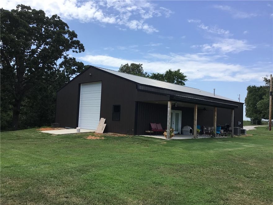 This Peaceful and secluded 18.48 acres is close to Fayetteville and Tontitown, Approx 10 cleared acres with barn, corral, gated access, spring fed creek, Multiple building spots, huge mature oak trees, rolling landscape, views of the ozark mountains.  The 2400 barndominum has 1 bedroom , 1 bath, 2 overhead doors, covered patio all heated and cooled.
