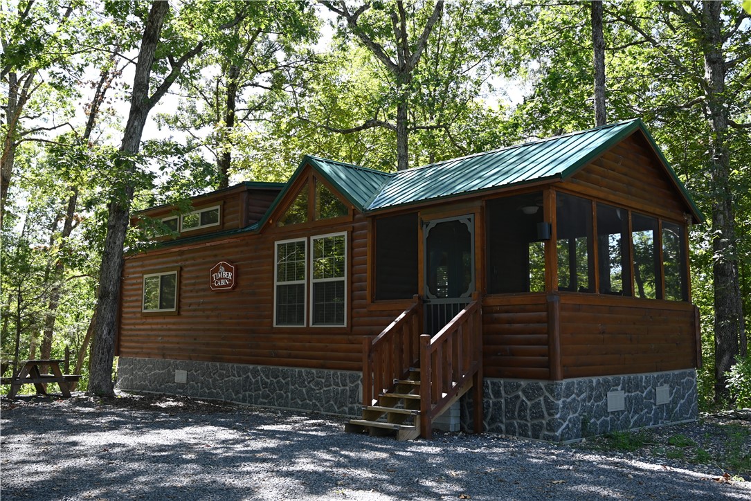 Fully furnished pre-fab cabin in the woods of north central Arkansas! Located in the heart of the Ozark Mountains, this charming retreat sits on appx. 1.75 acres with real wood “Log Look” siding & a metal roof. Set on a quiet dead-end road with rural water, electric and septic already in place. Currently a popular Airbnb but it’s fully equipped for full-time living as your own personal “Tiny House.” Enjoy peaceful surroundings & a nice view of distant mountains. Just 2 miles dirt road & under 9 miles to Marshall where you will find a very “Laid-back” slow paced, small community. Centrally located near top vacation spots & outdoor adventures including Branson, MO, the Buffalo National River, White River trout fishing, & three major lakes. This area of the Ozark Mtns offers a variety of outdoor activities including fishing, hiking, camping, swimming, boating, canoeing, kayaking & horseback riding. Whether you're looking for an income-producing rental, weekend getaway, or full-time escape—this property is a rare find!