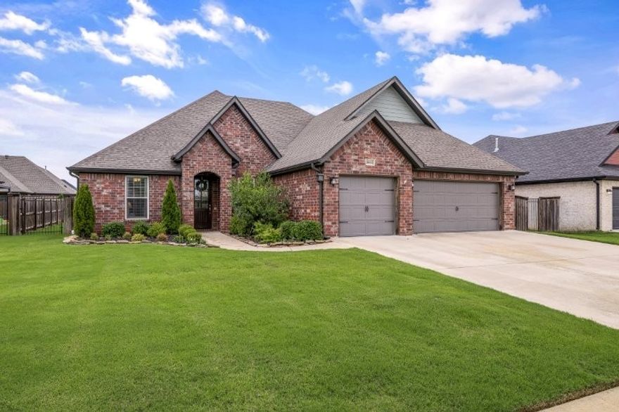 Beautifully maintained 4-bedroom, 3-bath home with a desirable split bedroom floor plan in a prime Bentonville location! The light and airy kitchen features white cabinetry, granite countertops, stainless steel appliances, gas cooktop, pantry, & a spacious breakfast area.  Formal dining room  with stunning chandelier opens to an inviting living room with fireplace & tray ceiling enhanced by crown molding & custom lighting.
The large primary suite offers a relaxing retreat with a soaking tub, walk-in shower, & a generous walk-in closet. Hardwood floors, tile, & carpet throughout add warmth & style. Additional highlights include a separate laundry room, 3-car garage, covered patio, & flat, fenced backyard—perfect for entertaining or play.
Located in a vibrant neighborhood with a community pool & playground, just minutes from highly rated schools &the Bentonville Community Center. Don’t miss this move-in-ready gem!