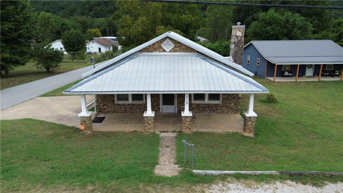 This 1215 SF, 2 BR, 1 BATH home is located in the quaint town of Jasper, Arkansas near the Little Buffalo River in the Ozark Mountains & Buffalo National River Region of Newton County Arkansas. This home is within walking distance to the historic Jasper Square (eating, shopping, services), Bradley Park (on the Little Buffalo River, pickle ball, swimming) & Jasper School (just across the street). There is a bonus room that could make it a 3BR. Partial basement (with walkout & access from inside) perfect for storm shelter and storage. It can only be residential or used as a medical (including chiropractor) facility. Newer HVAC, has a fireplace and maintains current termite policy. It is located in beautiful Newton County, Arkansas & near the Ozark National Forest. This central location is convenient to the best swimming holes, hiking, canoeing, wildlife photography and fishing. Other nearby outdoor activities include horseback riding, mountaineering, caving, & scenic driving. Also listed as residential MLS# 1319554.