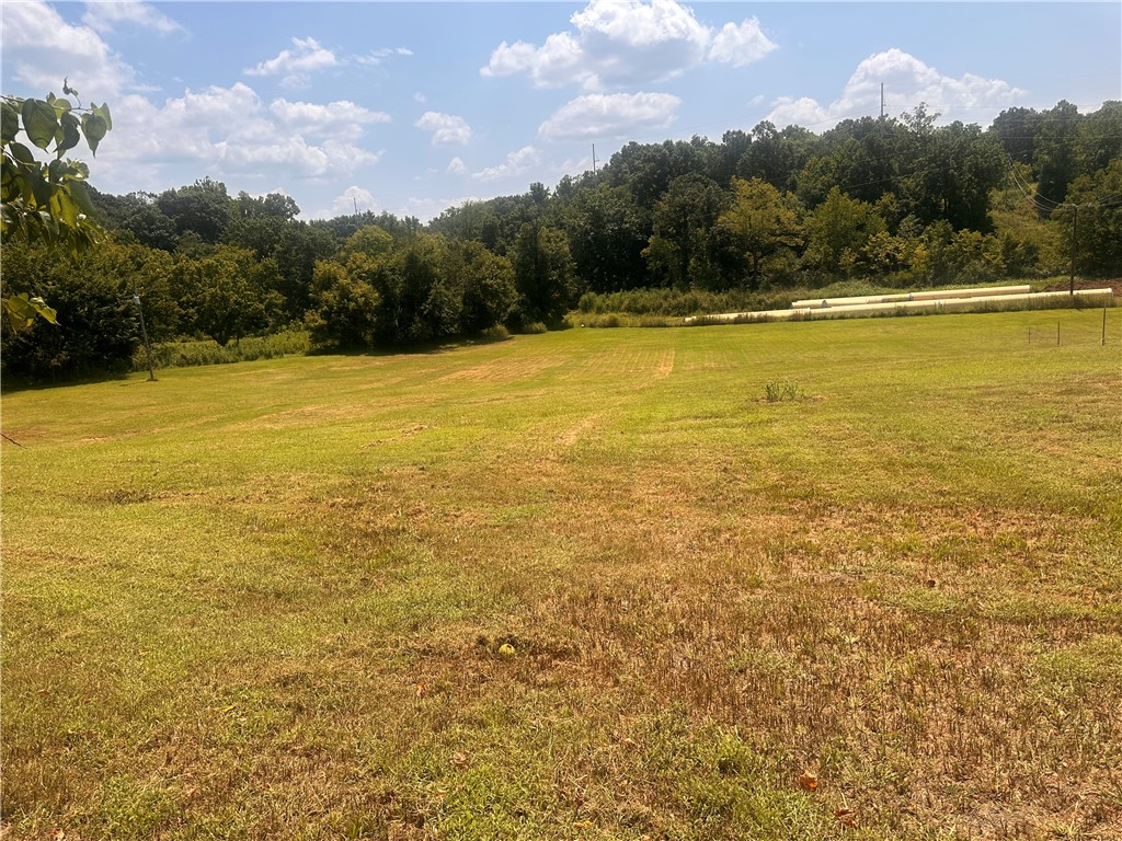2.5 acre track is an ideal location to build your dream home with electricity and soon water on site, has 900 feet of road frontage on Puppy Creek RD. This property offers easy access I-49 and soon Hwy 612. Close to the Razorback Greenway Trail. Has a sewer line that runs right down puppy creek.