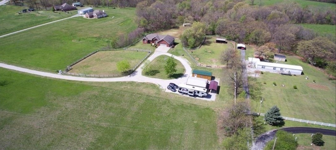 Imagine owning a serene 5-acre property within the Gravette city limits, where every day feels like a vacation. This beautiful land is fully fenced, ensuring privacy and security. The property is adorned with stunning trees that provide a picturesque and tranquil environment. Essential utilities such as city water, electricity and sewer are already on site, making it convenient for you to build your dream home. The previous home, which was unfortunately burned, has been removed leaving a clean slate for new possibilities. For those with a love for animals, there are outside buildings perfectly suited for housing them. Whether you envision a small farm or a peaceful retreat, this property offers the ideal setting. Come home to a place where nature's beauty surrounds you, and the convenience of city amenities is just a stone's throw away. This is more than just land; it's a lifestyle waiting to be embraced.