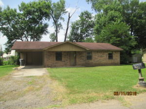 Brick and frame 3 bedroom, 1 1/2 bath home with single carport.