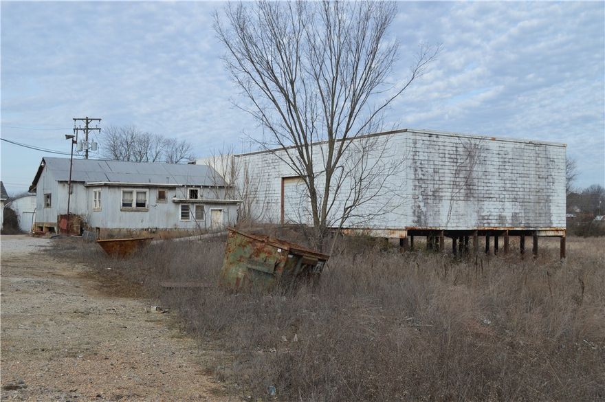 This property has been owned by the same family since 1932.  Ozark Steel is now for sale and a fresh development project.  The property consist of four parcels of approximately 11.2 acres with Hwy 71 Business frontage.  The property has several outbuildings all with concrete floors.  The Seller is offering it "AS IS" with a very large amount of steel I beams, rafters, and heavy equipment. The pictures do not even begin to convey the amount of steel to be sold with this property.