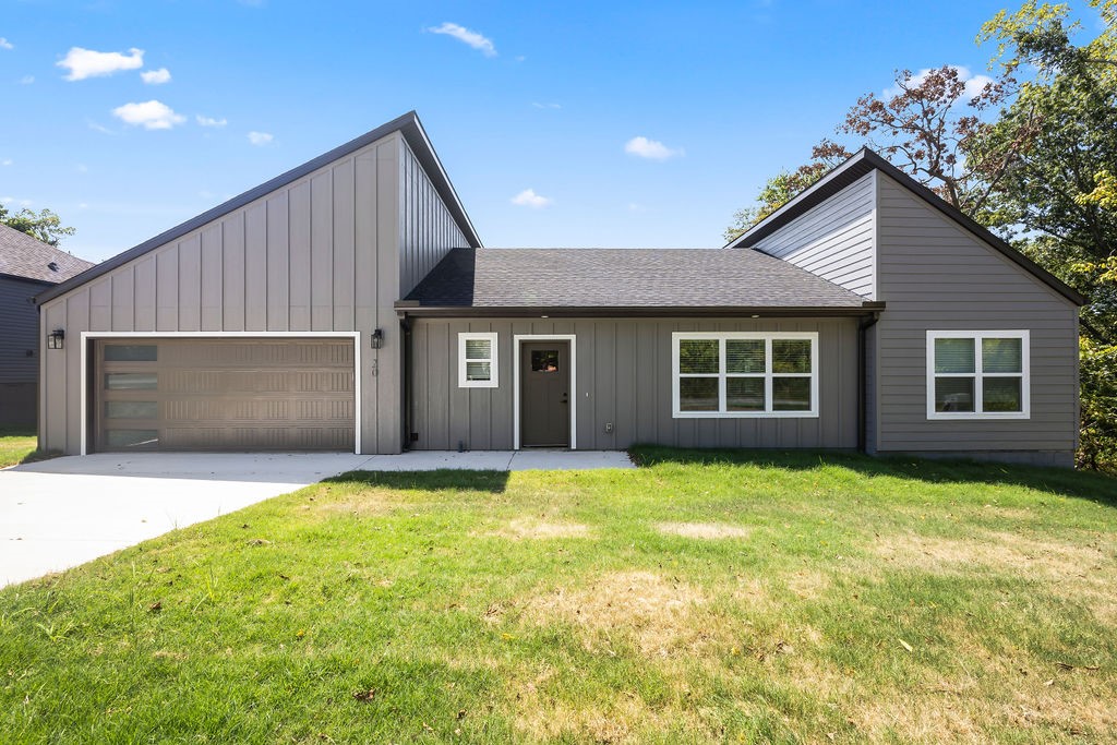 Come enjoy close proximity to everything Bella Vista has to offer in a NEW home. Lakes, golf courses, trails, shopping, restaurants - all just minutes away! Just 3 minutes from Highlands Crossing. Home's interior features an open layout, real hardwood floors throughout, gas fireplace, custom cabinetry, granite countertops, stainless steel appliances, and a pantry. Dedicated laundry room. Great lot and deck overlooking backyard and woods. Builder warranty. Ready for move-in now!