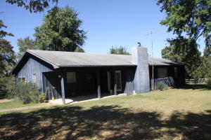 3/4 mile Bear Creek Frontage. 3 bedroom 2 1/2 bath home, 936 sq.ft, 3 car garage, barn, spring, great location fronting Hwy 14. *Home owner made several improvements to home including replacing the roof on home and garage.