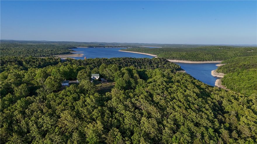 Are you searching for a family compound? This might just be the one for you. 
This stunning 18.9-acre property offers year-round lake views, privacy, and endless possibilities. Perfect for a homestead, weekend getaway, or investment opportunity with 4 bedrooms, 3 baths, and potential for more. 

The 52’ x 24’ detached workshop with a 2-car garage could be converted into a guest house, rental, studio, or additional living space.

Don’t miss this rare opportunity—schedule your tour today by contacting the listing agent directly!