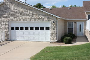 VERY NICE & WELL-KEPT CONDO IN QUIET, SAFE NEIGHBORHOOD! This 3BR/2BA condo w/ over 1300 sq. ft. is in a 55+, gated subdivision that is centrally located in town. Home has several skylights built in to allow in TONS of natural light, & a heated/cooled sunroom that walks out to a covered porch w/ privacy fence. Also, dual closets in one guest BR & 2 Car garage w/ extra built in shelves & cabinets.