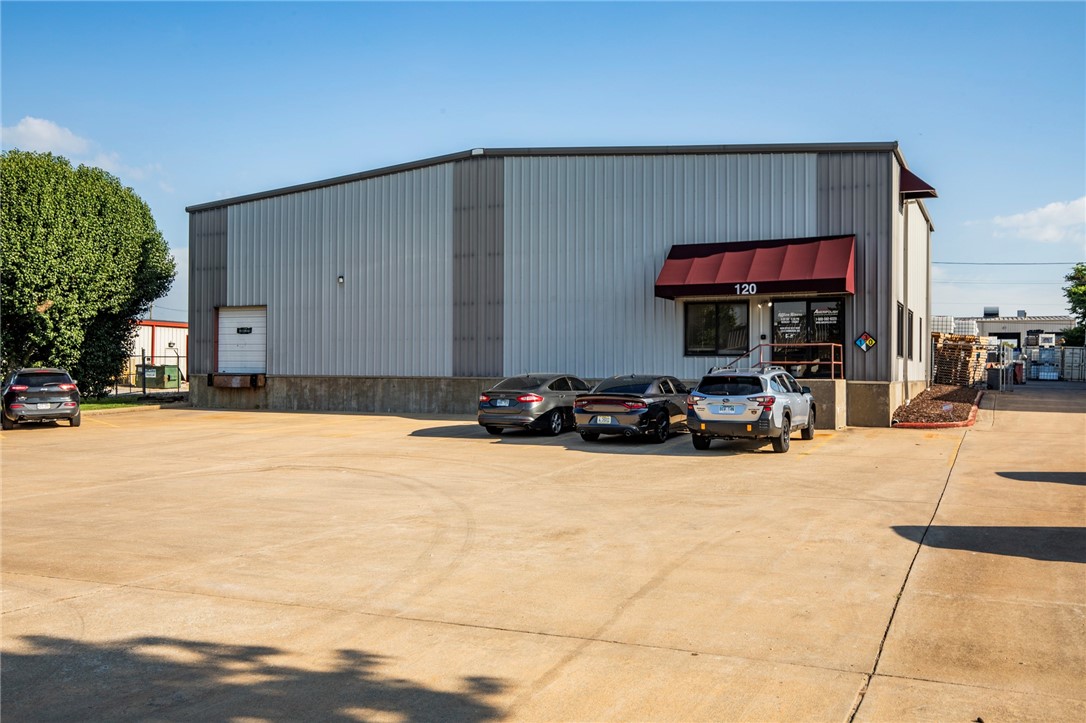 Welcome to this exceptional 12,000 sq. ft. commercial building located in the heart of the thriving business district! This prime property features a modern design with expansive open spaces, perfect for retail, office, or mixed-use applications. The building boasts high ceilings, large windows for ample natural light, several bay garage doors, large showroom and a 1900 square ft attached apartment with backyard for entertaining. There is a large upstairs bedroom/office room and bath with plenty of storage space. This has a flexible floor plan to accommodate various business needs. With easy access to major highways and plenty of parking, this location offers great visibility and foot traffic. Don't miss out on the opportunity to establish your business in this vibrant community. Schedule a tour today and envision the possibilities!