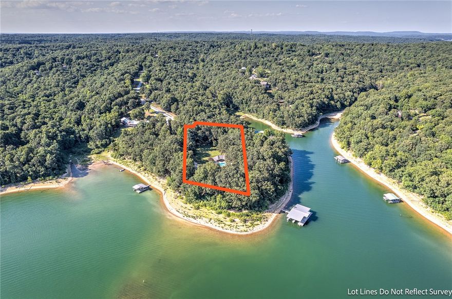 Welcome to your own private oasis! This stunning lake house sits on 2 acres right on Beaver Lake with a private gated entry, in-ground pool, pool house for entertaining and attached garage for storage. 
If you're looking for a boat dock, you'll love the easy off access to your 4-slip dock. The dock comes equipped with a cement tiled 64ft swim deck, 10x30 boat stalls, and solar power requiring minimal maintenance.  Inside the main house, you'll find a comfortable living area with plenty of natural light and lake views all year round. Unique features like a spacious sunroom, large windows throughout and a cozy gas fireplace make this property unforgettable.  Step outside onto the large deck that runs the length of the house and take in the views! The deck provides ample space for entertaining with a built-in hot tub where you can soak your cares away while enjoying the breathtaking scenery.  Whether you are looking for a peaceful retreat or space for entertaining family and friends, this house has it all!