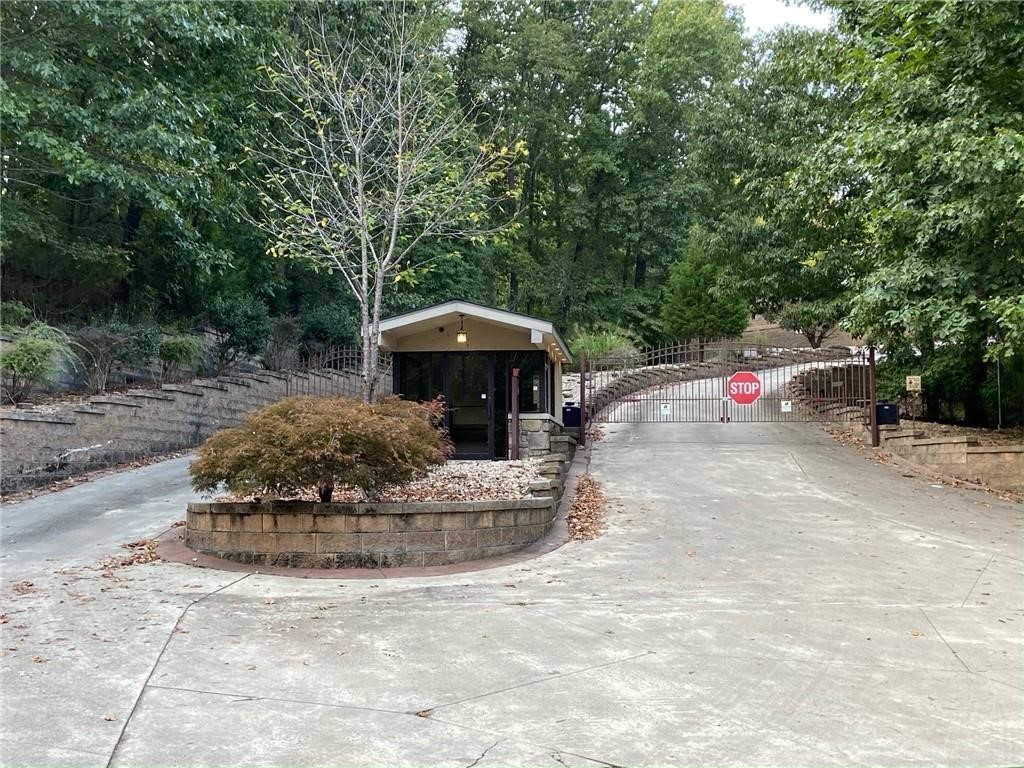 Build your dream home on this spacious lot in a gated subdivision near Beaver Lake. Enjoy the privacy, security, and some lots have a partial view of the lake.