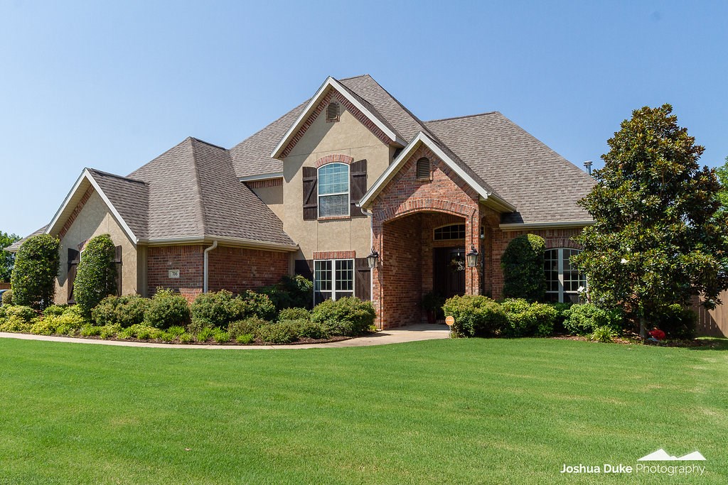 Stunning custom home offers private, gunite pool w/diving board, backyard oasis, 3 car side entry & garage & all the bells & whistles you won't find with any other home around! Loaded w/designer upgrades such as kitchen cabinets extending to ceiling/glass insert, granite, island, pantry, dbl ovens, gas range & desk. Opens to large family room w/wood flooring, FP & updated fresh paint colors throughout. Large Master Suite offers access to patterned concrete pool area, large bath & roomy walk in closet.