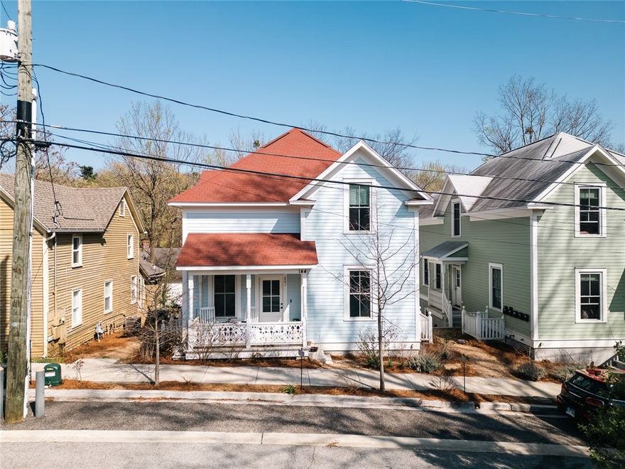 Just a few blocks from the vibrant Fayetteville Downtown Square and a five-minute walk to Ozark Natural Foods, this energy-efficient, low-maintenance home is part of a thoughtfully designed five-unit condo development that blends seamlessly into the neighborhood—an ideal example of missing middle housing. Inspired by Ozark vernacular farmhouse and craftsman design, this single-level residence features timeless architectural details paired with modern efficiency. The open floor plan is bathed in natural light from expansive windows, creating a bright, welcoming feel. The kitchen is both stylish and functional, boasting a gas range and a welcoming eating bar, perfect for entertaining. The private bedroom offers a cozy retreat, complemented by a beautifully designed bathroom featuring a charming clawfoot tub. With off-street parking and a walkable location near Dickson Street, the Fayetteville Public Library, and the University of Arkansas, this home effortlessly combines character, convenience, and thoughtful design.
