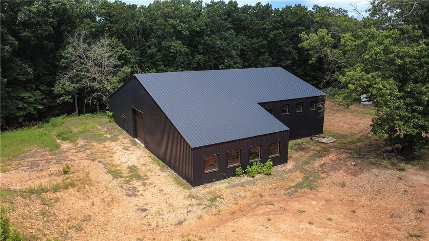 New construction warehouse/flex building ready for customization or finish-out under existing plans - plans include an office space, kitchen, full bath, laundry, and an open area for a potential showroom, workshop, or garage.  Building was designed and constructed by Quality Metal Inc.  14'x14' drive in doors on each end, perfect for RV, small or large equipment.  Shop area is equipped with 200-amp electrical service, while 100-amp service exists in other areas of the building.  Septic system and plumbing have been installed, and water is provided by a 653' well with 10.5 ppm.  Beautiful secluded location, ideal for a wide range of potential uses.