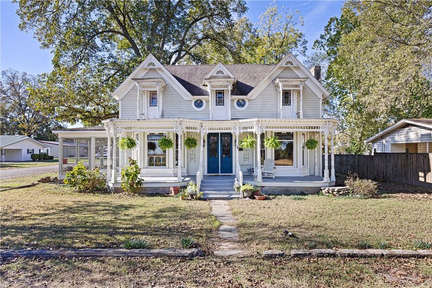 Welcome to this stunning historical Victorian Steamboat Gothic  home, nestled in the heart of Dardanelle! Overflowing with classic charm and timeless appeal, this 3- (possibly 4-) bedroom, 1 Updated Bath, and 1 Bath ready for your imagination-bath gem captures the beauty of days gone by, with rich architectural accents and warm, inviting spaces throughout. The spacious layout includes and a cozy fireplace perfect for chilly evenings, a formal dining room ideal for hosting gatherings, and beautifully preserved wood details that add a touch of elegance in every room. The two-car garage provides ample storage and convenience, while a backyard offers a serene escape for outdoor relaxation.
