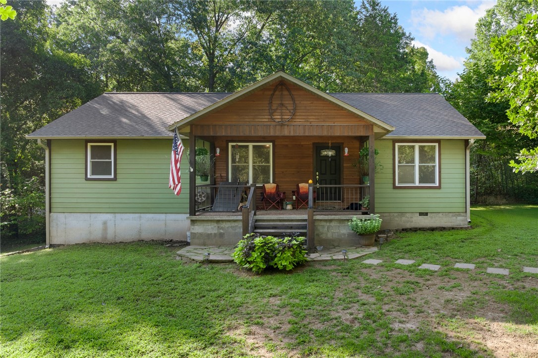 Discover the perfect blend of comfort and nature in this beautifully maintained 2102 sq ft home in Alpena, Arkansas. With 3 bedrooms, 3 baths, and a versatile basement space, this residence offers both privacy and functionality. The heart of the home is a stunning kitchen featuring custom cabinets and a spacious pantry. The property boasts a peaceful setting surrounded by woods, complete with a back deck and covered front porch for enjoying the peaceful setting. An extra room in the basement offers flexibility as a home office or gym, alongside a garage with ample storage space. The master suite is a luxurious retreat, featuring a spacious bedroom, a spa-like bath with a large tub, and a generous walk-in closet. This home offers relaxation and comfort, waiting for you to make it your own.