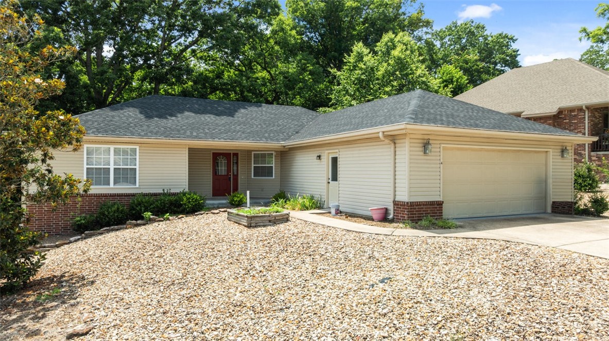 WOW~ Amazingly well cared for home! New Roof! High ceilings w/ Open Floor plan w/ decorator shelving above between entry & eat-in kitchen,Wood look Luxury Vinyl Planking & tile throughout! Kitchen is fabulous w/huge amount counter space,solid wood cabinets tile backsplash! Breakfast Bar.Canned lights in Kitchen,dining & living room.Covered front porch + screened covered deck + open deck. Covered & Open deck overlooking wooded common property.Perfect for relaxing any time of day. Blinds throughout. Extra cabinets everywhere and some huge pull out drawers! Kitchen has undercounter lighting & canned lighting above + informal dining. Fireplace to decorate in warmer months and snuggle by cooler times.Main Bedroom w/pan ceiling & bath w/whirlpool tub & walk-in shower w/enormous counter/sink area & walk-in closet.Great utility area w/huge laundry sink + cabinets + hanging area + extra huge cabinet for storing! Door from garage to Low maintenance yard. Magnolia Tree front yard.Flat driveway w/enough room to park more cars.