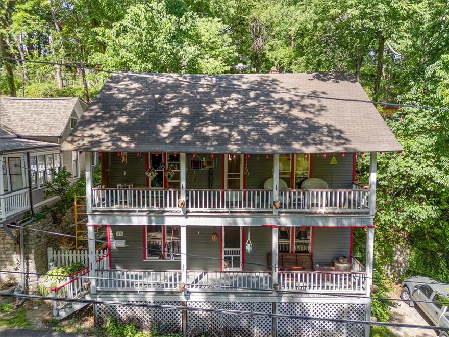 Beautiful Historic home CIRCA 1900 in the PERFECT location right in the heart of downtown Eureka Springs. It is located on a quiet one way street that offers residents a romantic neighborhood lined with victorian homes, quaint cottages and craftsman bungalows. Only steps away from all that Spring Street offers including five star restaurants, art galleries, boutiques, spa's, & night life. This home has a lot to offer as she sits but could certainly be a knockout when fully restored. Historic Preservation credits could be easily accessed to assist you in refurbishing this lovely lady and restoring her to her previous splendor. Hardwood floors are such a nice feature as well as a great layout. All the social living spaces including the living room, dining, kitchen, laundry & full guest bath are on the main floor while all 3 bedrooms and 2nd full bath are upstairs. Each floor features great outdoor spaces, with huge covered porches and a private terraced garden in the back yard with a seating area & room for the grill