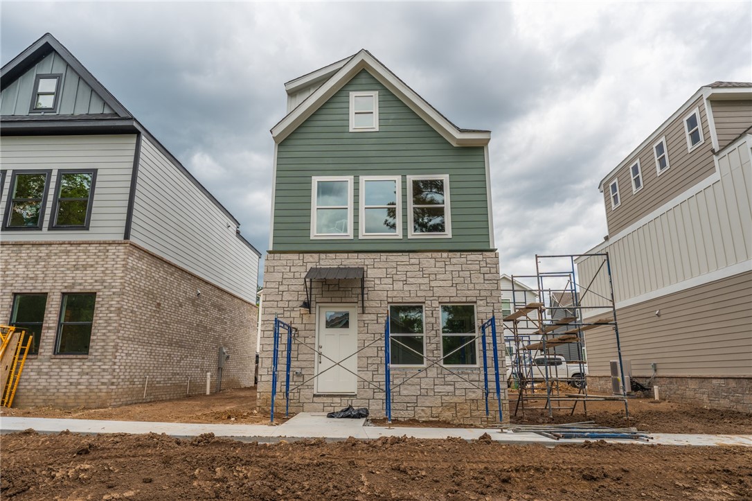 Brand new 2 BR/2 BA townhomes in south Fayetteville located close to U of A, Baum-Walker Stadium, The Ramble, Razorback Greenway, I-49, and all of Fayetteville's downtown area. This beautiful home features luxury vinyl plank throughout. The primary bedroom, kitchen and living area are on second level with the second bedroom and utility room on the first level. Kitchen has a pantry and both bedrooms have walk-in closets. Tub/shower combos in both baths. Third floor loft provides flex space. 2 car garage. Agent owned.