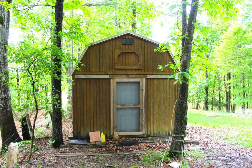 Nice 4.92 acres. Has unfinished 220 sq ft Tiny home. Insulated and has some Electric installed. Toilet and base for shower. Also Vinyl plank flooring in boxes will convey. Finish out or build your dream home. Not Far from Beaver Lake access in 2 directions. Peaceful, quite country setting for full time or cabin. The area is surrounded by Hobbs State Park Wildlife Management Area so the roads are well maintained. Hobbs is the largest state park in Arkansas, the 12,054-acre park spans the southern shore of Beaver Lake. The park includes over 36 miles of trails for hiking, mountain biking, horseback riding, campsites, an outdoor shooting range (closed on Mondays for maintenance), an interactive visitor center, and is the only state park in Arkansas to allow regulated hunting. The property abuts Hobbs on the North boundary.  Equal distance to Rogers or Eureka Springs. Two 10 X 16 storage Buildings available for extra $$, or they will be moved prior to closing.
