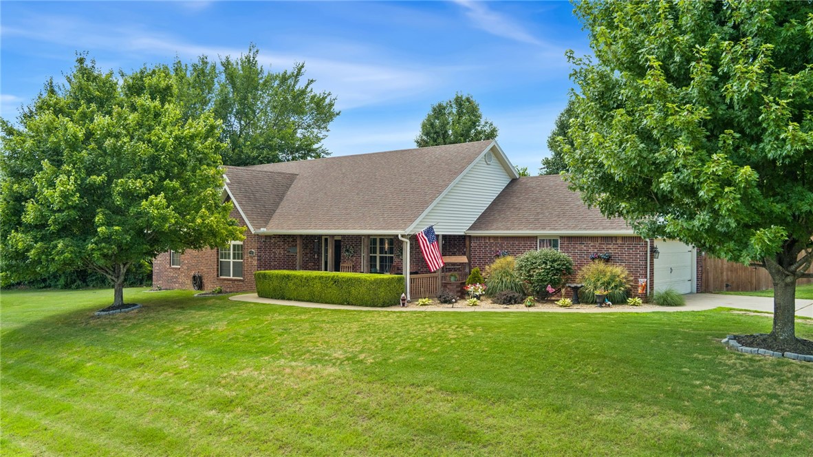 Welcome to this peaceful property featuring an all brick home that provides the serenity of the country with the convenience of being in the city. Situated on a large, level 0.7 acre lot, this property provides ample elbow room and seclusion, but is located just minutes from Fayetteville in Farmington.
With 3 large bedrooms, 2 bathrooms, and an eat in kitchen, this home is functional and simple. Relax in the morning and evenings on either your front porch with mountain views, or in your tranquil privacy fenced backyard. Featuring an attached two car garage, extended attic storage, and an exterior shed that conveys, there is no shortage of storage available.
From the moment you arrive you will notice the landscaping and curb appeal. The large living room is inviting and situated close to the eat in kitchen with granite counters and a breakfast bar. The primary suite is expansive and radiates elegance and comfort. The separate laundry features an additional sink for convenience!