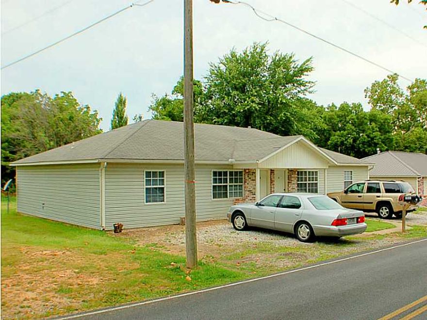 Great investment property - both sides rented at $475. Located in quiet residential area outside Rogers city limits. Nicely finished and clean interior. Owner may finance $10k for 5 yrs. Roof appears due for replacement. Tenants mow lawn.