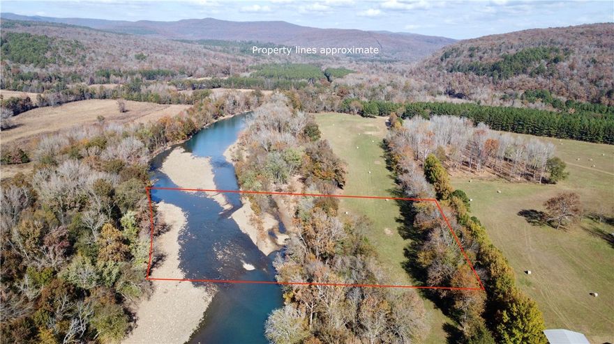 3 Acre Mulberry Riverfront lot with 246 ft of river frontage on one of the Mulberry river’s best floating stretches. Water and electric at the road with deeded access via shared gravel road. Just 13 miles north of I-40 on scenic Hwy 23. Enjoy Ozark National Forest views, waterfront serenity, and the sound of the river from your future deck or cabin site. A rare chance to own prime riverfront property in the Ozarks.

The land will need to be surveyed prior to closing.