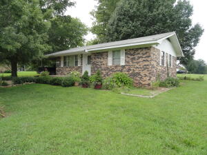 Nice 2 bed 1 bath home in a great neighborhood at the edge of Marshall. The double lot makes this yard almost an acre in size that is level and plenty big enough to make a large garden. Big shade trees, brick exterior, carport, outside storage building, less than 1 mile to Harps grocery store, 2 blocks to the community center, tennis, swimming, baseball field, walking track and Senior Center. 1 mile or less to 5 places to eat.