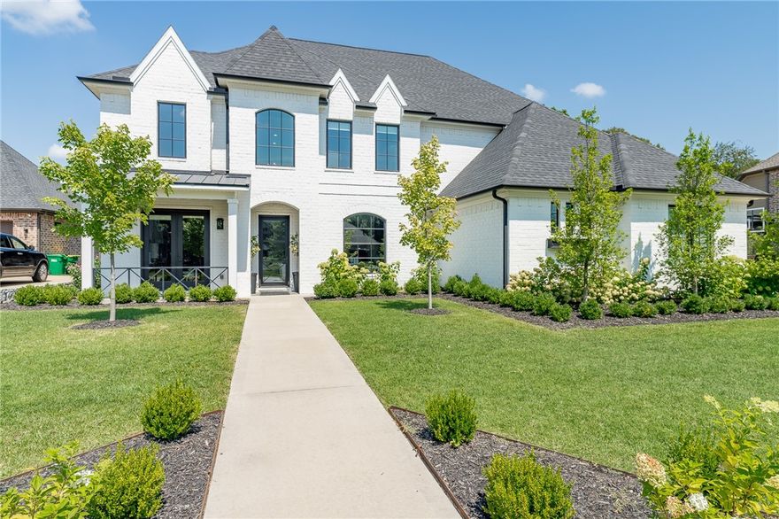 This showstopper was a 2017 Parade of homes winner, winning 3 awards; Best Overall, Best Curb Appeal, Best Floor Plan! Custom built in 2017 & features amenities that go above & beyond. This 5 BR, 4.5 BA home has upgraded lighting & appliances, 3 cm marble, quartz & granite counter tops, hardwood floors, interior custom made wood trim, premium hardware, sliding wood & glass doors, natural wood ceiling beams & white oak flooring. The open kitchen is an entertainers dream featuring Jenn-Air appliances, EMTEK satin brass hardware, ice maker, counter-top seating, built-ins, & a walk in pantry. Primary suite features wood floors, views of outdoor pool, separate vanities in the master BA with lighted mirrors & a walk-in marble rain shower with 2 shower heads. This showstopper also features a XL theater room with a 9 ft bar, a mudroom, an elegant formal dining room with a custom wine wall, covered patio, 3 car XL garage, & so much more. See attached amenity list for more info. This is a property you don’t want to miss.