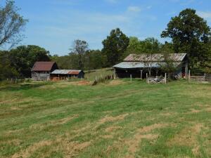 Estate Auction - 200 Acres Pasture, Hay Fields, and Wooded Land, 2 ponds, 2 year-round spring branches, spring with tank & pump supplies house, frame farm house, approx 1,570 sq ft, 4 bedrooms, 1 1/2 baths, needs repairs and updating, wood frame barns and sheds, approx. 80 acres pasture & hay fields, balance wooded, quiet and private end of lane location within 12 miles of Harrison. Estate Auction October 30, 2021, personal property begins at 10:00 AM, real estate at 11:00 AM. Terms: Property will sell to best bid above $600,000, accepted bidder to deposit $10,000 and sign a standard purchase contract with No Contingencies (the deposit is refundable only by default of seller), closing to be within 45 days. Sale is Subject to Boone County Circuit Court Approval.