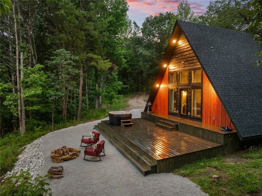 If you are seeking a great rental business opportunity with consistent rental income or a forever home with additional guest homes, this turnkey, fully furnished, large-capacity 2,800-sq-ft, retreat with a 4 BR, 2.5 BA cabin and detached garage plus a 1 BR 1 BA A frame cabin and a 1 BR 1 BA bungalow on 13.94 acres nestled in a natural setting with breathtaking mountain views, this is it. Your family will have a blast exploring the area and relaxing in the hot tub after a long day on the hiking trails or floating the Buffalo National River, gather ‘round the fire pit making s'mores, and gazing at the views. You’ll be close to Jasper, the Buffalo National River, Ozark National Forest, multiple outdoor activities, and an hour to Branson MO. This property is stunning to say the least. Don't miss your chance on this income producing property!