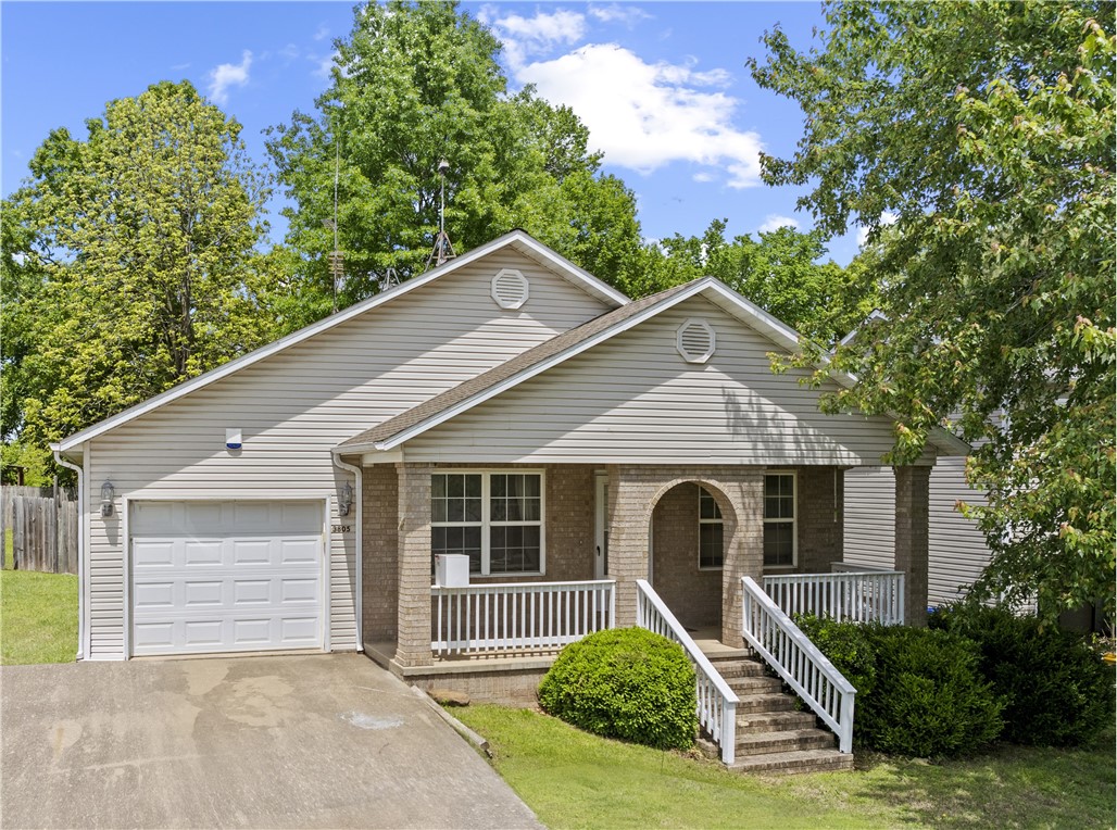 Get ready to relax on this covered front porch, shaded by large mature trees, and accented with established landscaping. This is a nice 3 bedroom, 2 bath home with a single car garage, and privacy fenced back yard that has a 10x12 deck and 2 outbuildings. You could use one for your yard toys, and the other for a hobby/workshop. The front entry opens up to an open floor plan where the kitchen and living room are unobstructed for a great entertaining space. The extra wide hallway and doorways allow for ample accessibility for all your family needs. The Primary Suite has a large walk-in closet, large full bath and sliding doors for access to the back yard. Call soon for your opportunity to take a look at this great property.